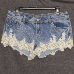 Denim shorts with lace and pearl accents